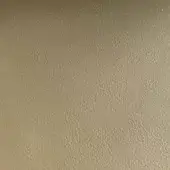 Rugiano indoor leather swatch, tan-brown Nu 181, displays a matte finish with a consistent, fine-grained, pebbled texture and diffused lighting.